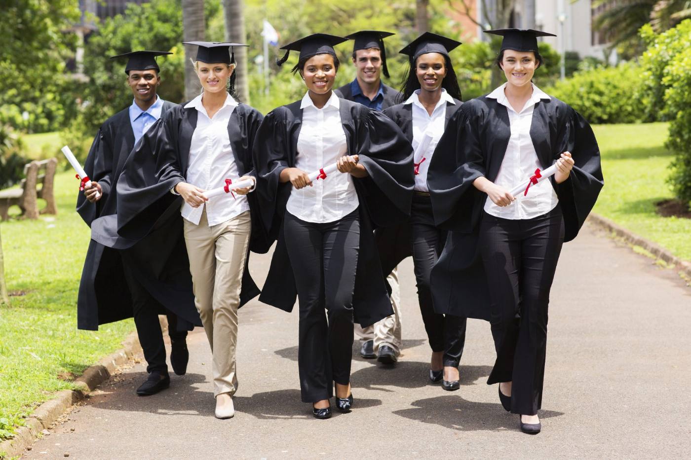 Graduates walking together on campus